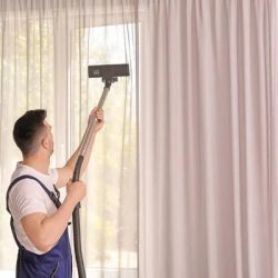 imgi_96_depositphotos_196808458-stock-photo-male-worker-removing-dust-curtains